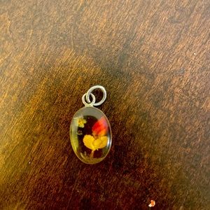 Vintage sterling silver and flowers set in lucite pendant